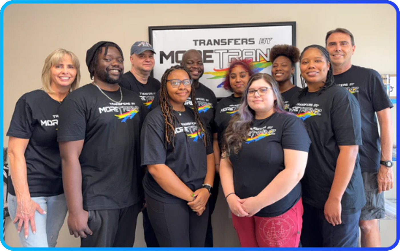 The MoreTranz team at our Lawrenceville, Georgia print shop, wearing shirts pressed with our own DTF transfers